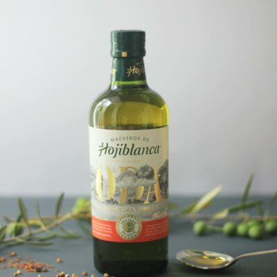 High-quality olive oil bottle with rustic elements, perfect for cooking or decor.
