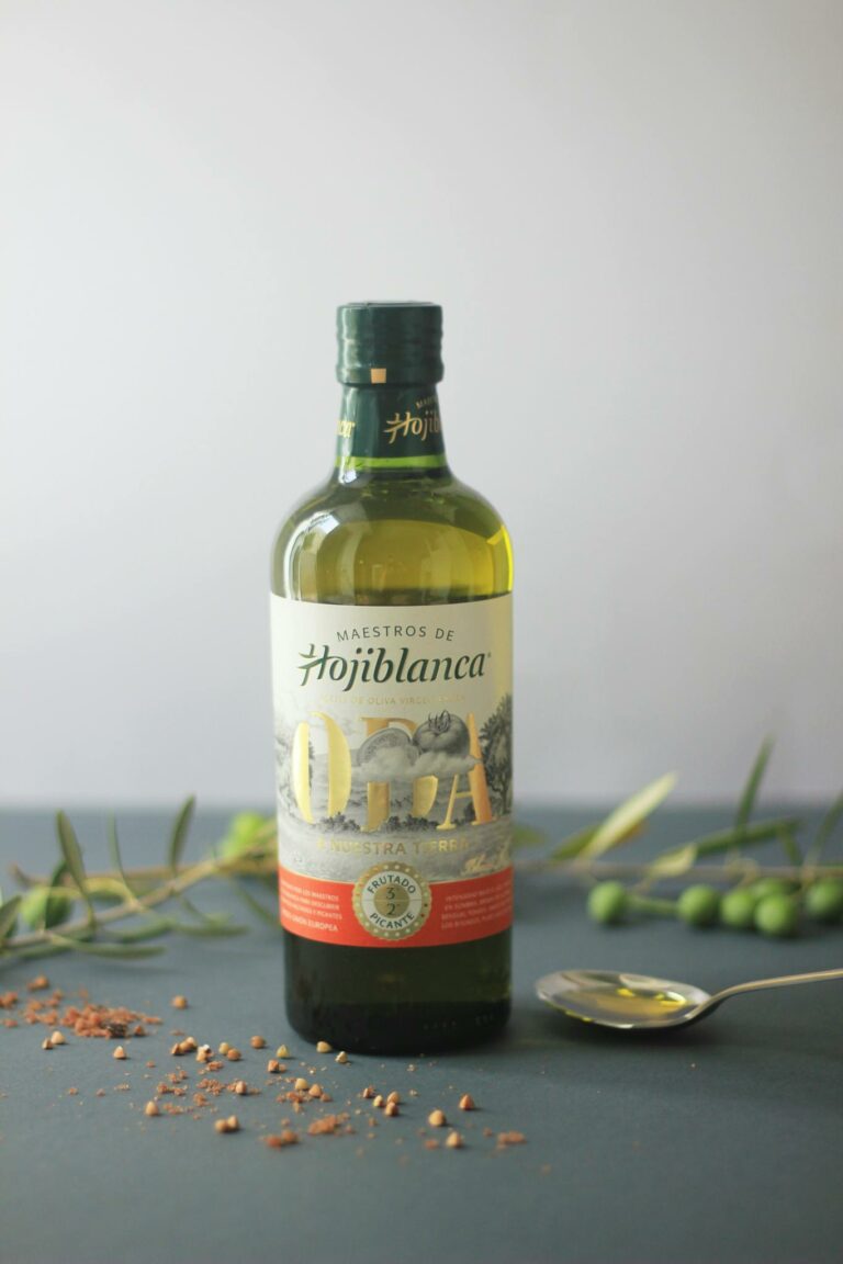 High-quality olive oil bottle with rustic elements, perfect for cooking or decor.