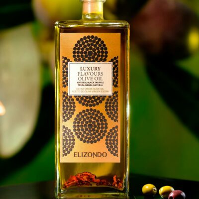 Luxury olive oil bottle surrounded by fresh olives against a vivid backdrop. Perfect for culinary and gourmet themes.