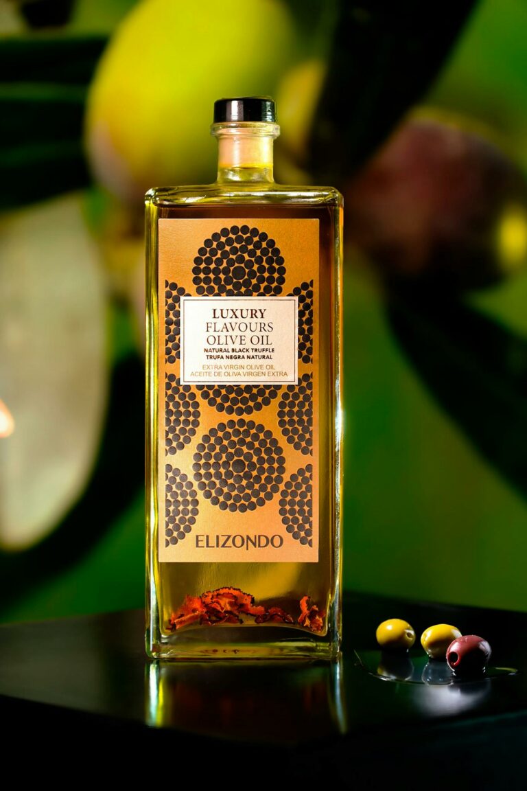 Luxury olive oil bottle surrounded by fresh olives against a vivid backdrop. Perfect for culinary and gourmet themes.
